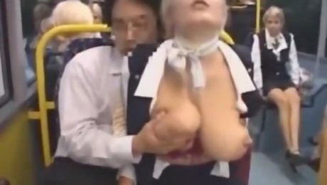 Busty stewardess gives handjob on bus, takes cumshot