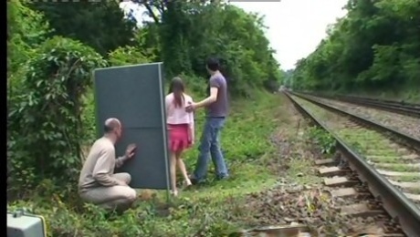 A guy jerks off while watching a couple fucking outdoors