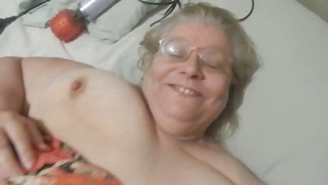 Chubby grey haired mature whore was playing with her huge boobies