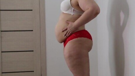 BBW shakes stuffed belly and fat ass in panties. Fetish.