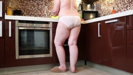 Mature BBW MILF in only white panties in the kitchen.