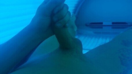 Boy masturbating in solarium